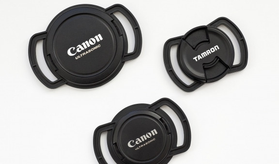 Novel lens cap strap holder claims to be a strapping solution for losing lens caps